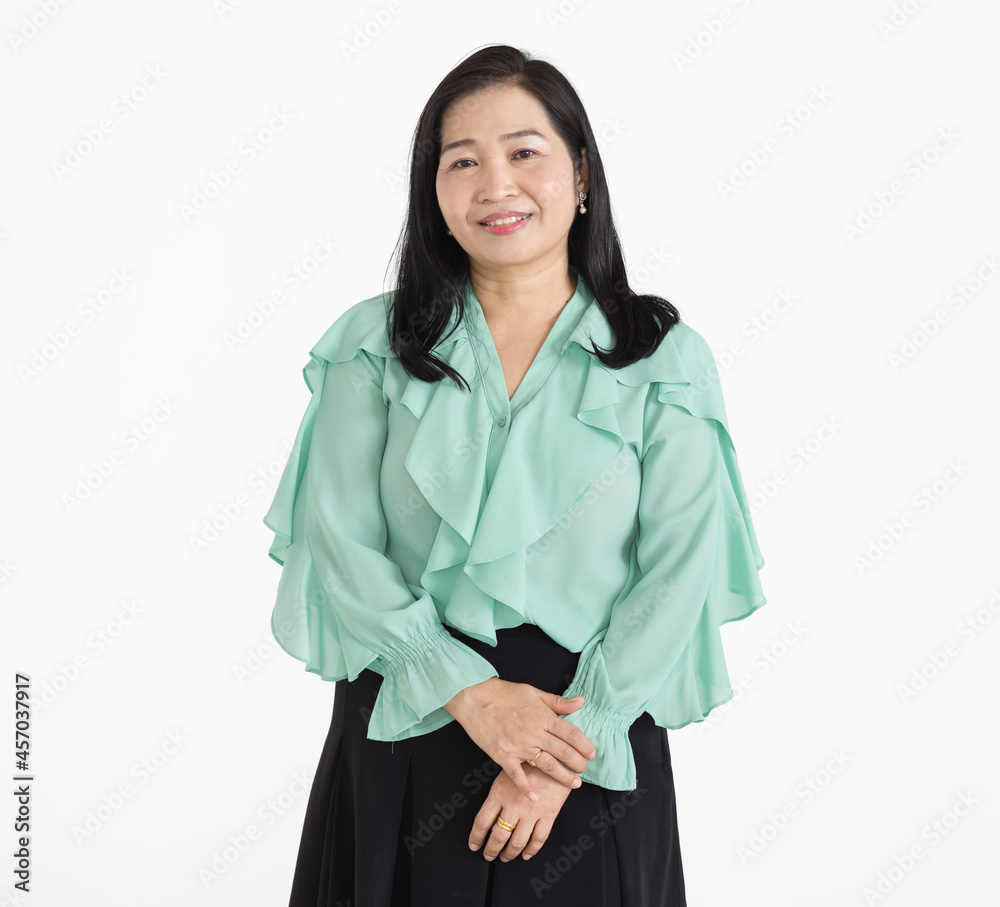 Portrait of middle aged Asian woman wearing mint green blouse looking neat smiling beautifully with confident isolated Portrait of middle aged Asian woman wearing mint green blouse looking neat smiling beautifully with confident isolated