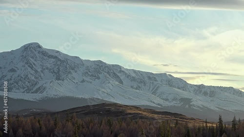 Timelaps of Severo-Chuisky mountain range and running clouds on Sunset. Altai Mountains, Russiia photo