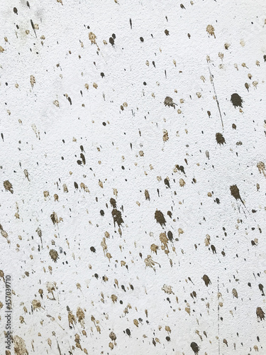 white wall is splashed with cement. texture background