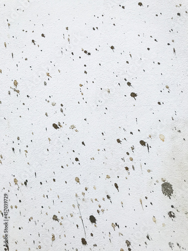 white wall is splashed with cement. texture background