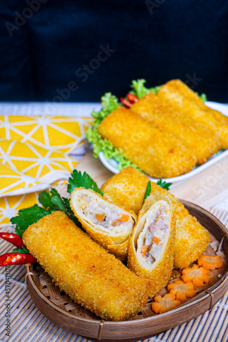 Delicious Risoles or Risol Vegetable is a typical Indonesian traditional street food made from flour skin, meat and vegetables stuffing inside, decorated with chilies and woven bamboo