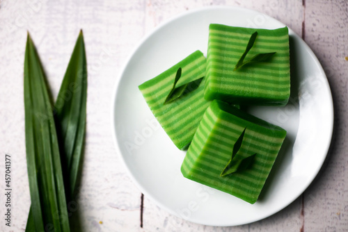 Kue lapis means layers cake, Indonesian traditional food. Made using soft rice flour pudding, it usually consists of two layers of different colors, grey and green