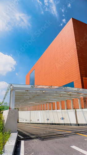 Entrance to the underground parking lot next to the brick red building