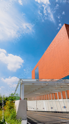 Entrance to the underground parking lot next to the brick red building