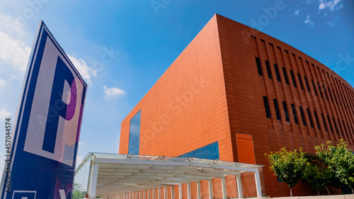 Entrance to the underground parking lot next to the brick red building