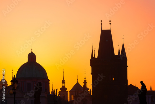 Sunrise over the capital of the Czech Republic - Prague city with silhouettes of buildings 