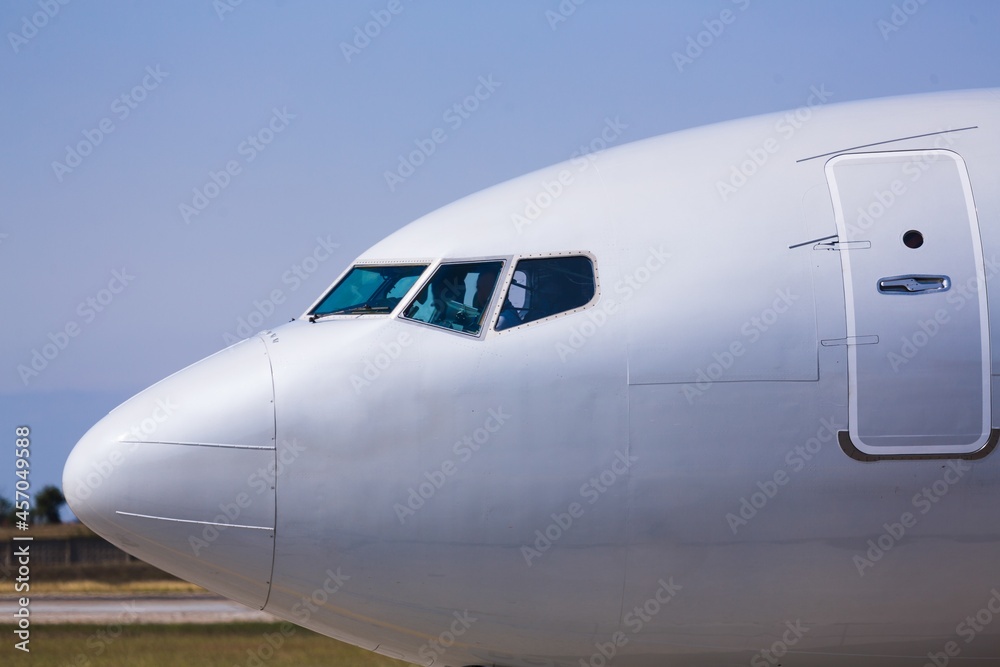 Runway at the airport and the plane flies and landing.