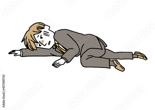 倒れているスーツを着た男性