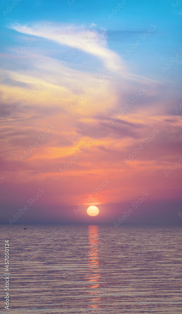 Big sun and sea sunset background.