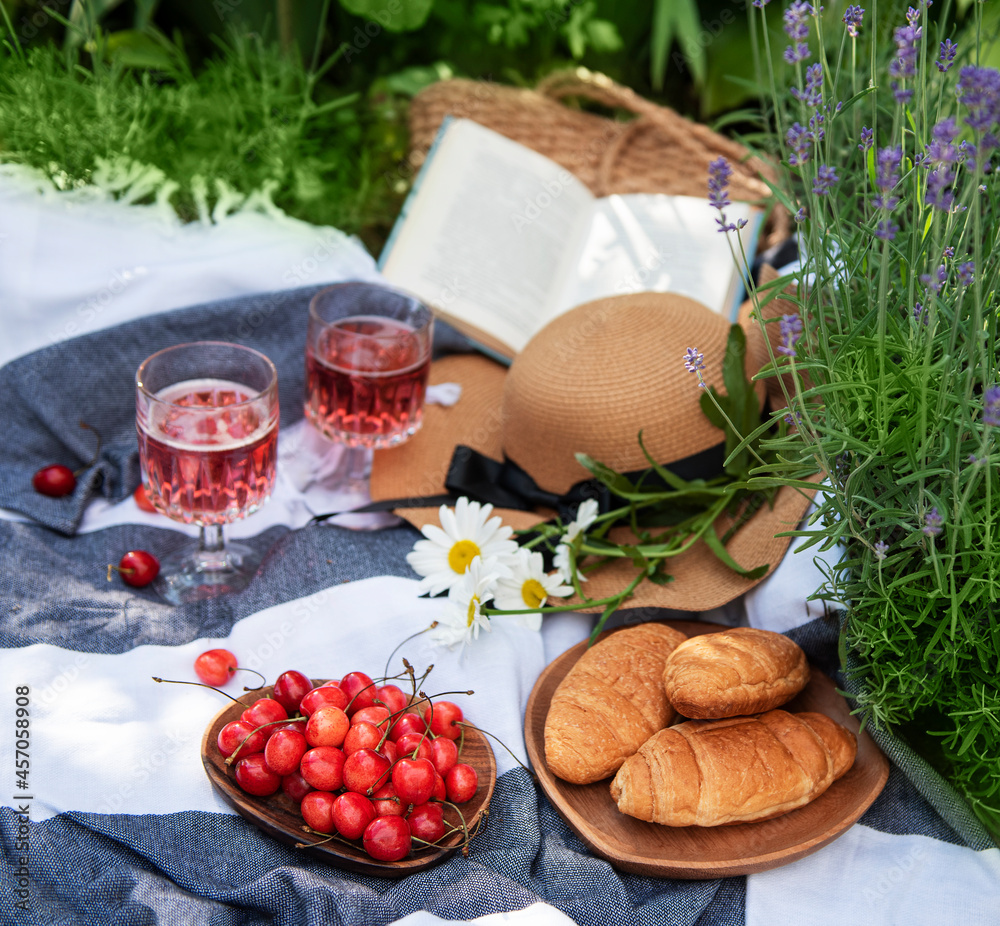 Set for picnic on blanket in lavender field Set for picnic on blanket in lavender field