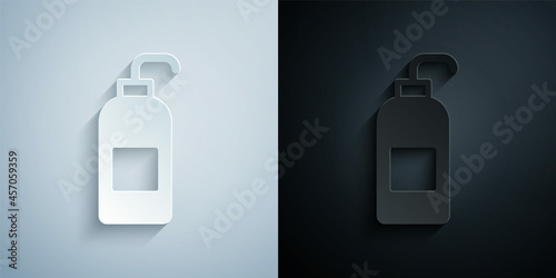 Paper cut Bottle of liquid antibacterial soap with dispenser icon isolated on grey and black background. Antiseptic. Disinfection, hygiene, skin care. Paper art style. Vector