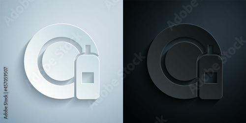Paper cut Dishwashing liquid bottle and plate icon isolated on grey and black background. Liquid detergent for washing dishes. Paper art style. Vector