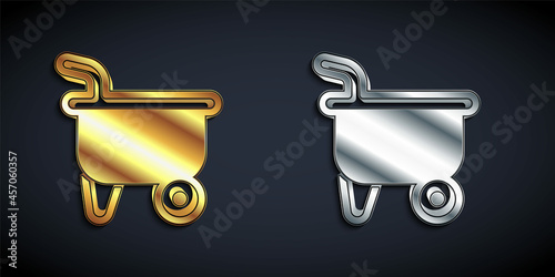 Gold and silver Wheelbarrow icon isolated on black background. Tool equipment. Agriculture cart wheel farm. Long shadow style. Vector