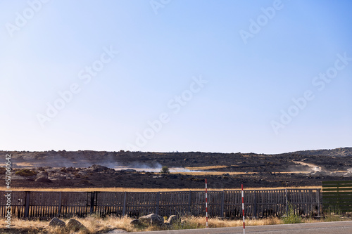 Landscape of a hillside burned by a forest fire. Hazard concept, climate change