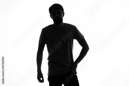 a man in the shadows gesturing with his hands anonymity studio incognito