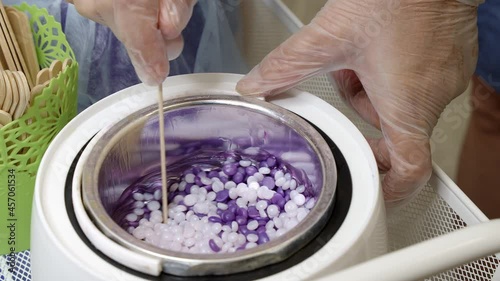 Shooting of wax melting and wooden stick for depilation