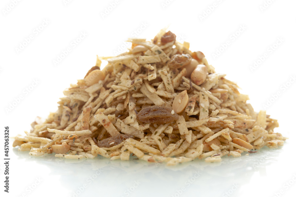 Close-Up of Aloo Mixture, made with potatoes sliced, raisins, peanuts, Indian spicy snacks (Namkeen), in a pile or heap, isolated over white background