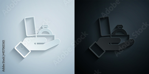 Paper cut Diamond engagement ring in a box icon isolated on grey and black background. Paper art style. Vector