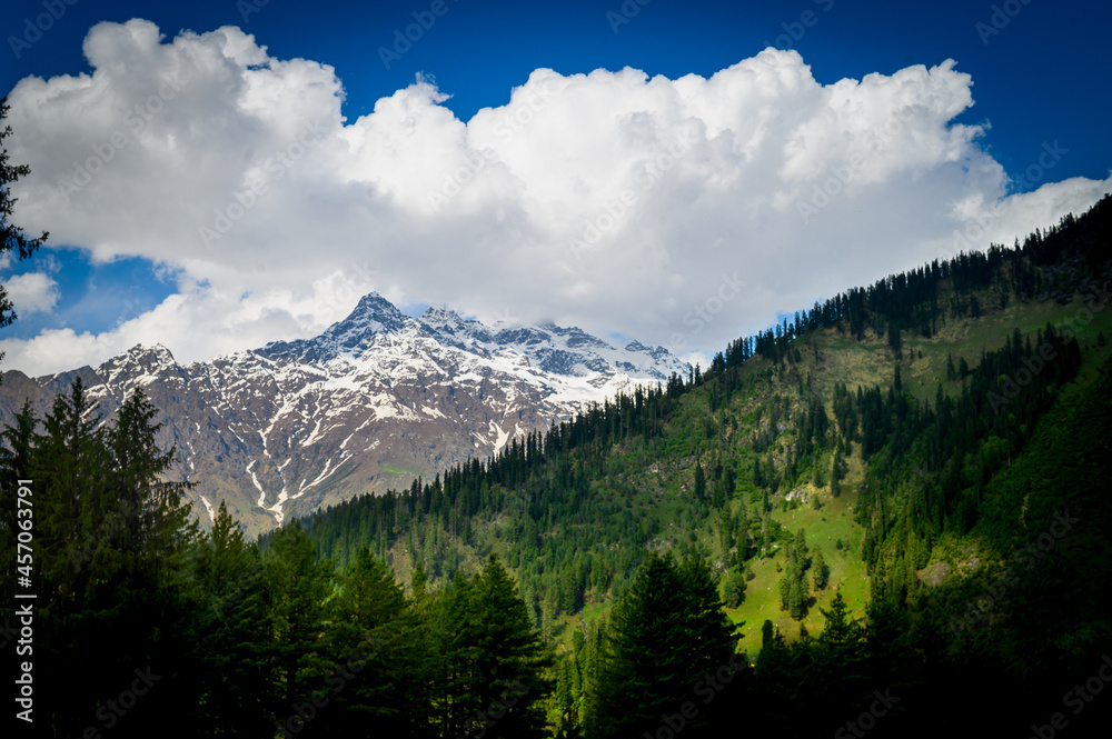 Landscape in the mountains. Alpine meadow in the mountains. Scenic view of Himalayas peaks and alpine landscape on the trail of Sar Pass trek  Himalayan region of Kasol, Himachal Pradesh, India.