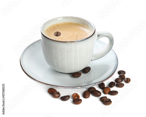 Cup of tasty coffee and beans isolated on white