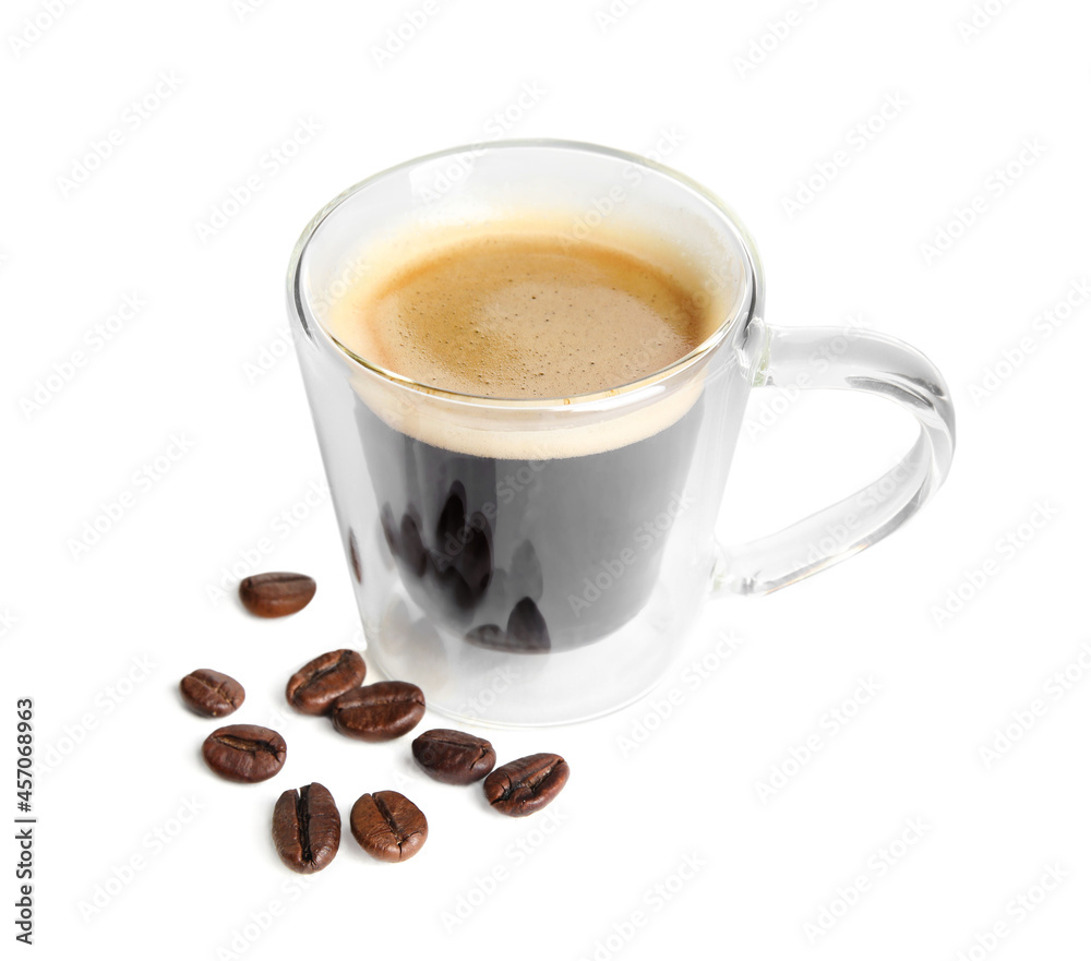 Cup of tasty espresso and scattered coffee beans on white background