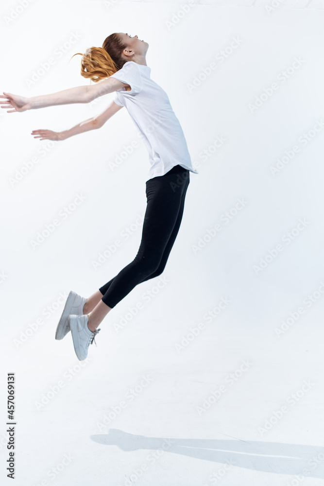 woman in sports uniform big energy lifestyle jumping light background woman in sports uniform big energy lifestyle jumping light background