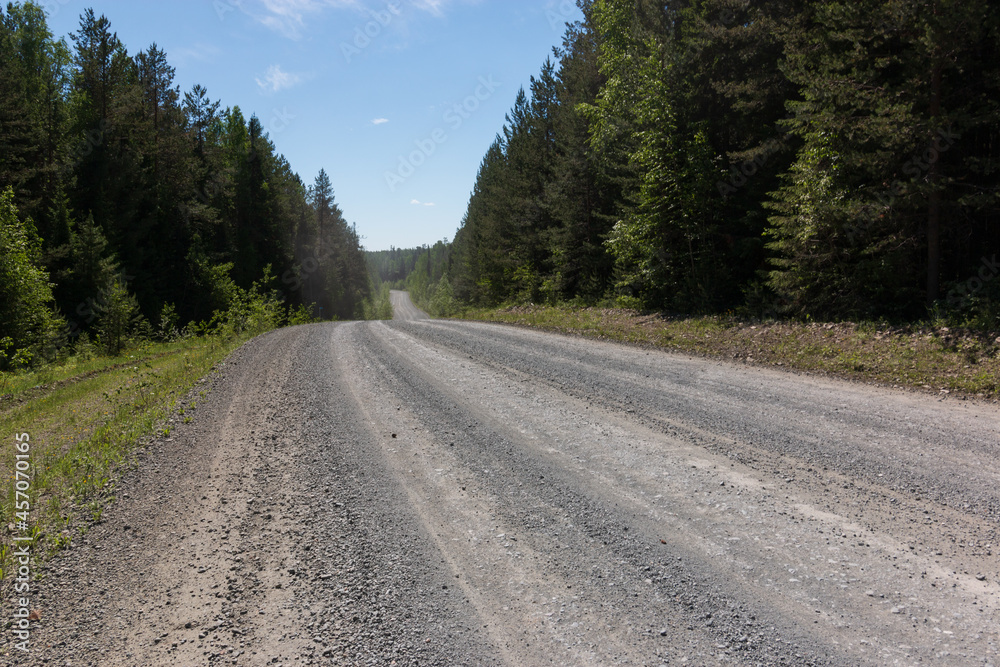 road from rubble through the forest