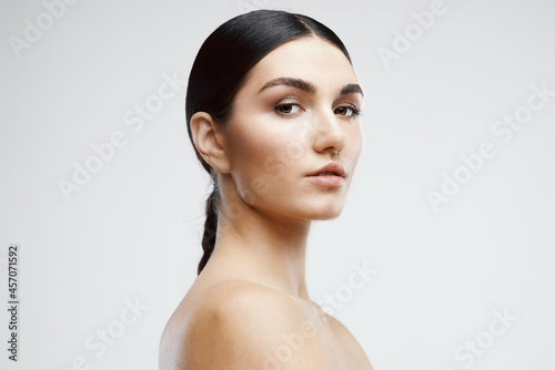 woman with bare shoulders clean skin cosmetology care