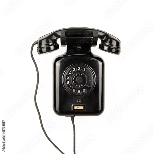 Black vintage telephone isolated on white background