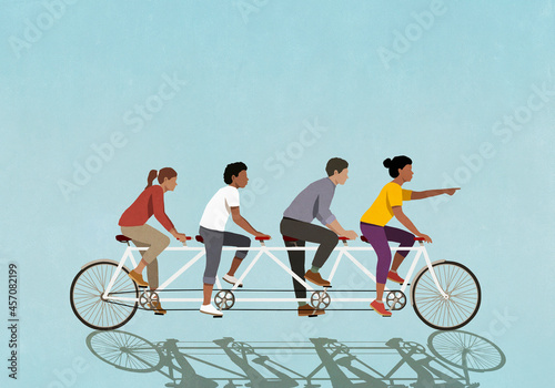 Friends riding tandem bicycle on blue background
