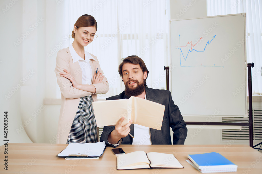 man and woman in the office work communication team man and woman in the office work communication team