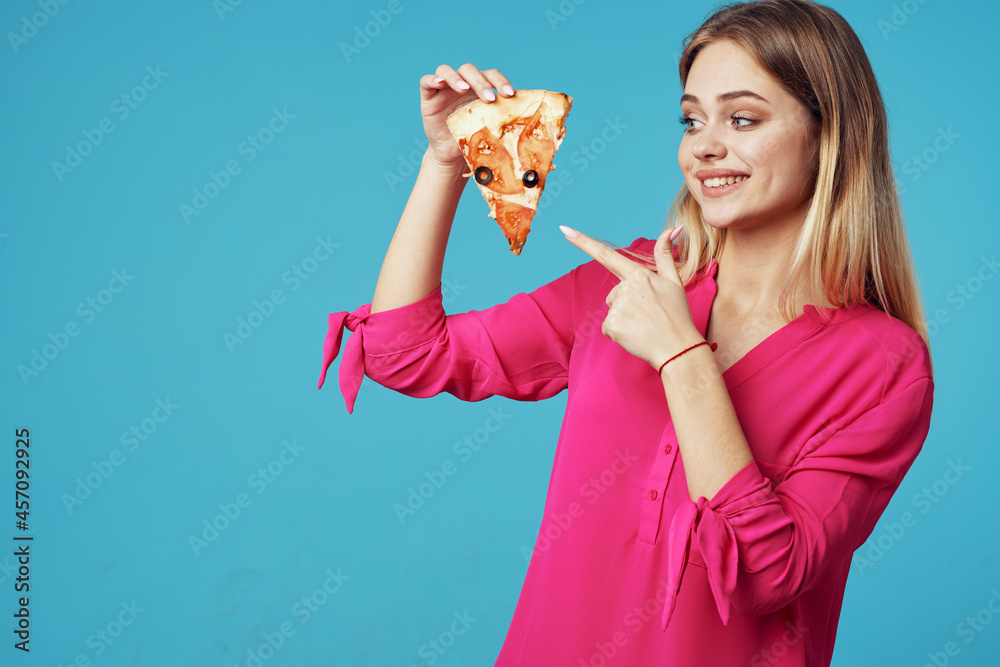 woman in a pink shirt with pizza in her hands junk food close-up woman in a pink shirt with pizza in her hands junk food close-up