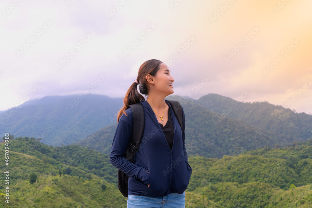 Female tourists in beautiful nature in mountain , concept tourists backpack.