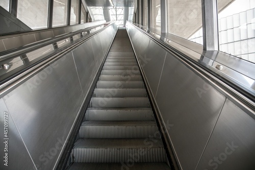 empty escalator in a subway station in Vienna diminishing perspective © Erich