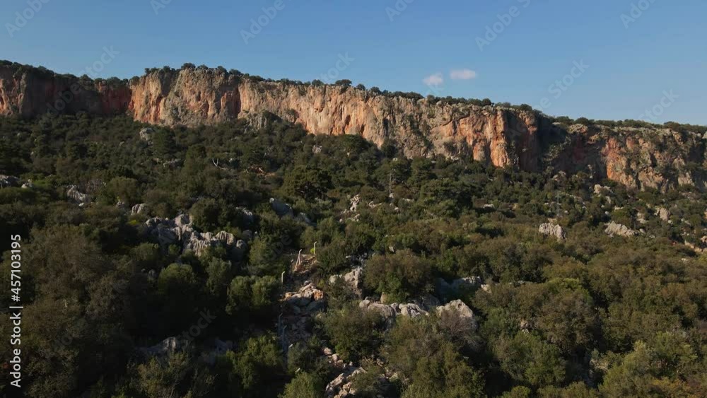 Parallax effect, aerial view from drone on amazing limestone cliff rocky wall and mountains on background. Parallax effect, aerial view from drone on amazing limestone cliff rocky wall and mountains on background.