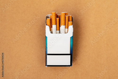 Pack of cigarettes with cigarettes sticking out photo