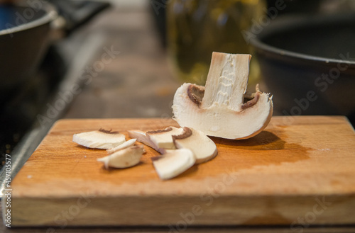 Half mushrooms and pieces on a cutting board
