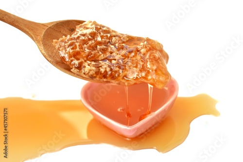 honey dripping from spoon