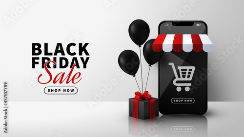 Black Friday online shopping with smartphone, ballons  and black gift box