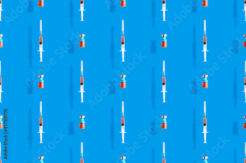 Medical syringes seamless pattern. Background on the theme of medicine, vaccination and human health.