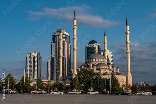 Russia, Chechen Republic city of Grozny. View to the mosque the heart of Chechnya and the skyscrapers of Grozny City at sunset photo