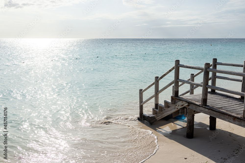 Beautiful tropical steps into turquoise sea water