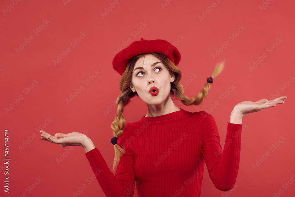cheerful woman in a red sweater cosmetics emotion studio posing cheerful woman in a red sweater cosmetics emotion studio posing