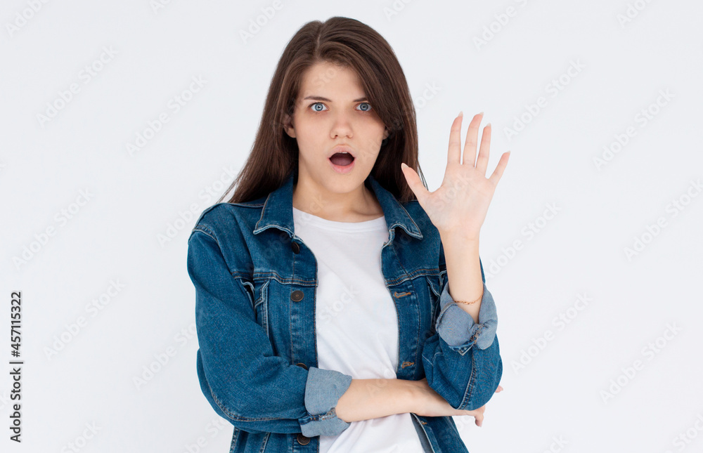 Stop right now. Offended and shocked woman showing block gesture, telling no, frowning and looking insulted with disgusting offer, refusing, standing against white background. Stop right now. Offended and shocked woman showing block gesture, telling no, frowning and looking insulted with disgusting offer, refusing, standing against white background.