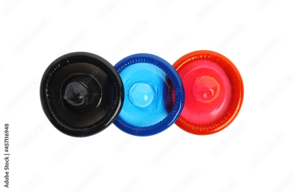 Unpacked colorful condoms on white background, top view. Safe sex Unpacked colorful condoms on white background, top view. Safe sex