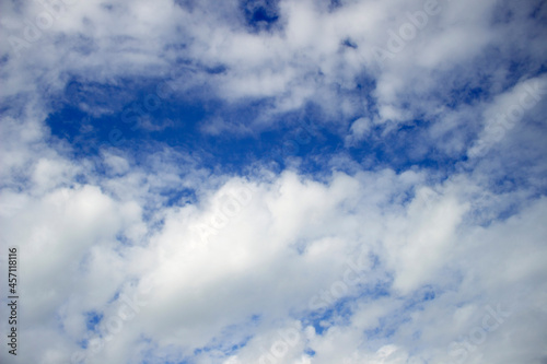 Blue sky background with clouds. Natural background.