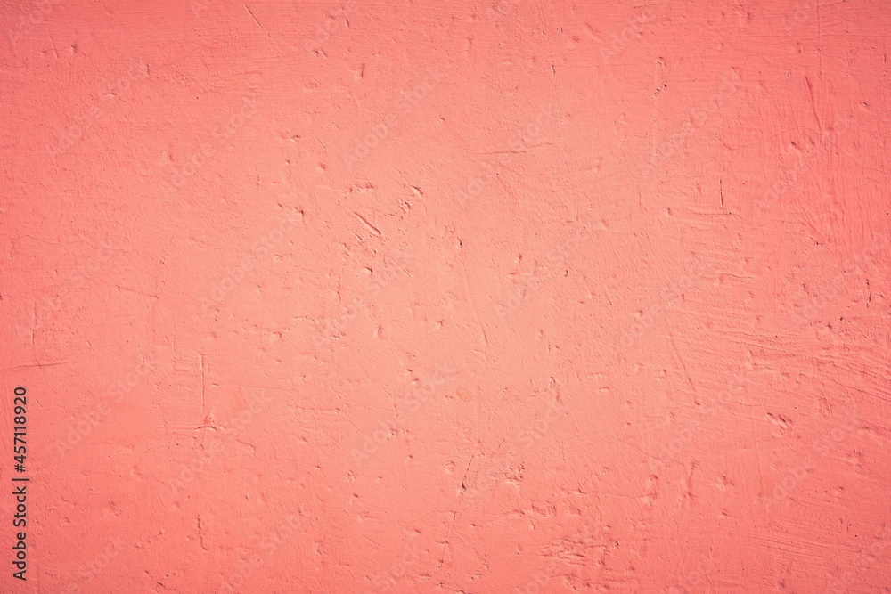 Old pink wall in spots, cracks, stains. Painted concrete wall in abstract grunge style loft. Vintage wall background texture for backgrounds, portraits, posters. Old pink wall in spots, cracks, stains. Painted concrete wall in abstract grunge style loft. Vintage wall background texture for backgrounds, portraits, posters.
