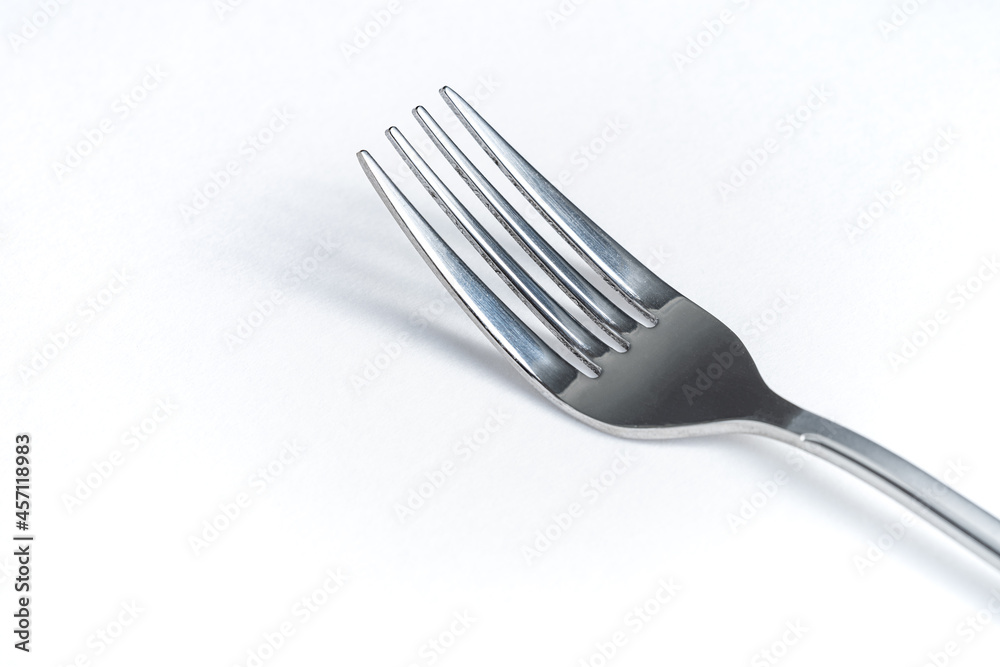 A Sliver Fork on White Background, Cutlery or Cooking, Macro Photograph A Sliver Fork on White Background, Cutlery or Cooking, Macro Photograph