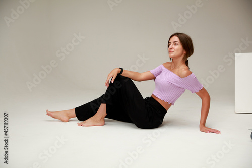 Girl posing on   white background of   cyclorama © DariaTrofimova