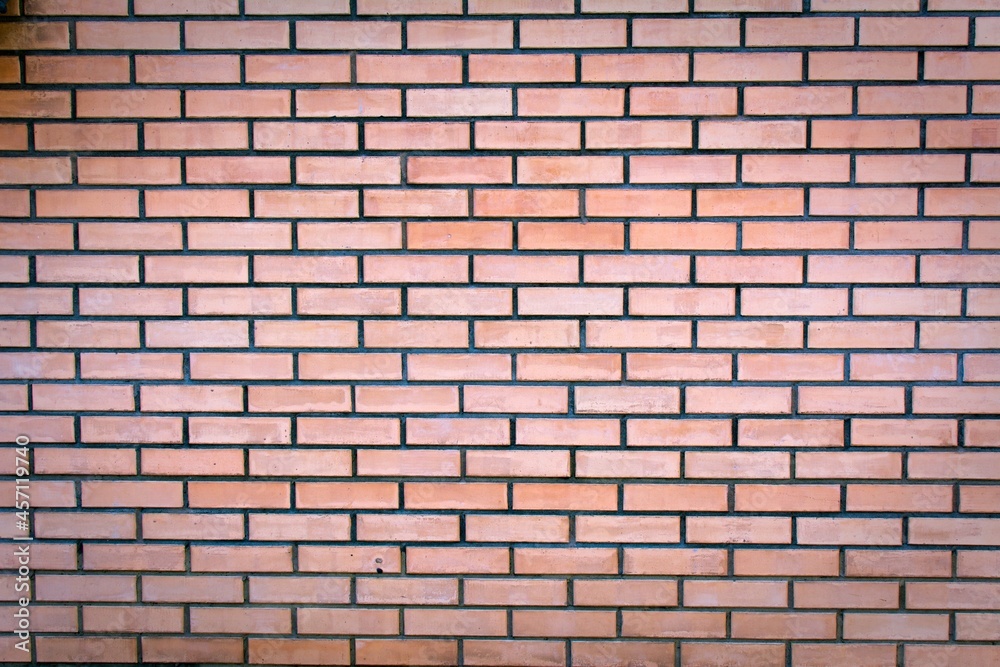 Weathered stained old brown brick wall background Weathered stained old brown brick wall background